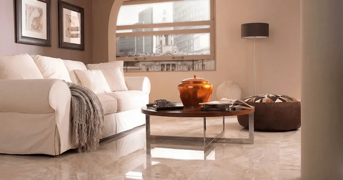 Modern living room with professionally installed marble flooring, a beige sofa, coffee table in San Diego, CA
