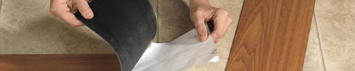 A professional installing vinyl flooring in San Diego, CA